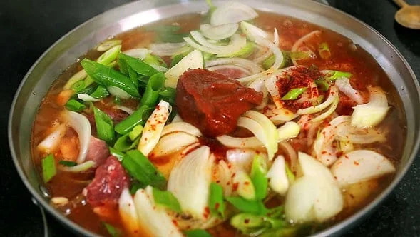 Adding seasonings to the stew